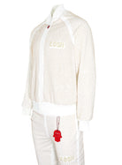 Kash Crystal Track Jacket with Hamso Logo 2.0 Elastic Waistband Drawstring closure Color: White and Gold Crystals 100% Polyester Wrinkle Free Material Fits true to size